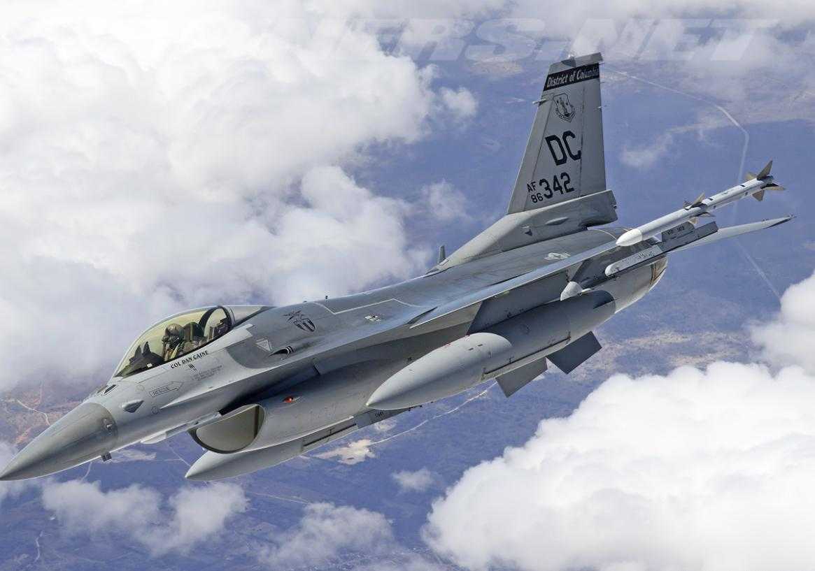 Photograph of ADMA Caine flying an F-16.